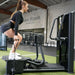 Abs Company Glute Zone Training System With A Woman Performing A Cable Squat On Gym Setting