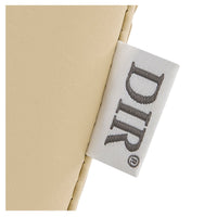 Thumbnail for Anode Adjustable Leg Salon Shampoo Chair Close-Up View Of Beige Upholstery With Brand Name