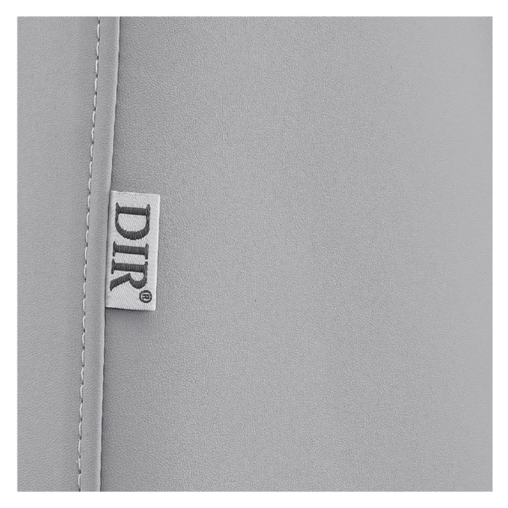 Aurora 4-Motors Swivel Medical Procedure Chair Close-up View Of Gray Upholstery With Brand Name