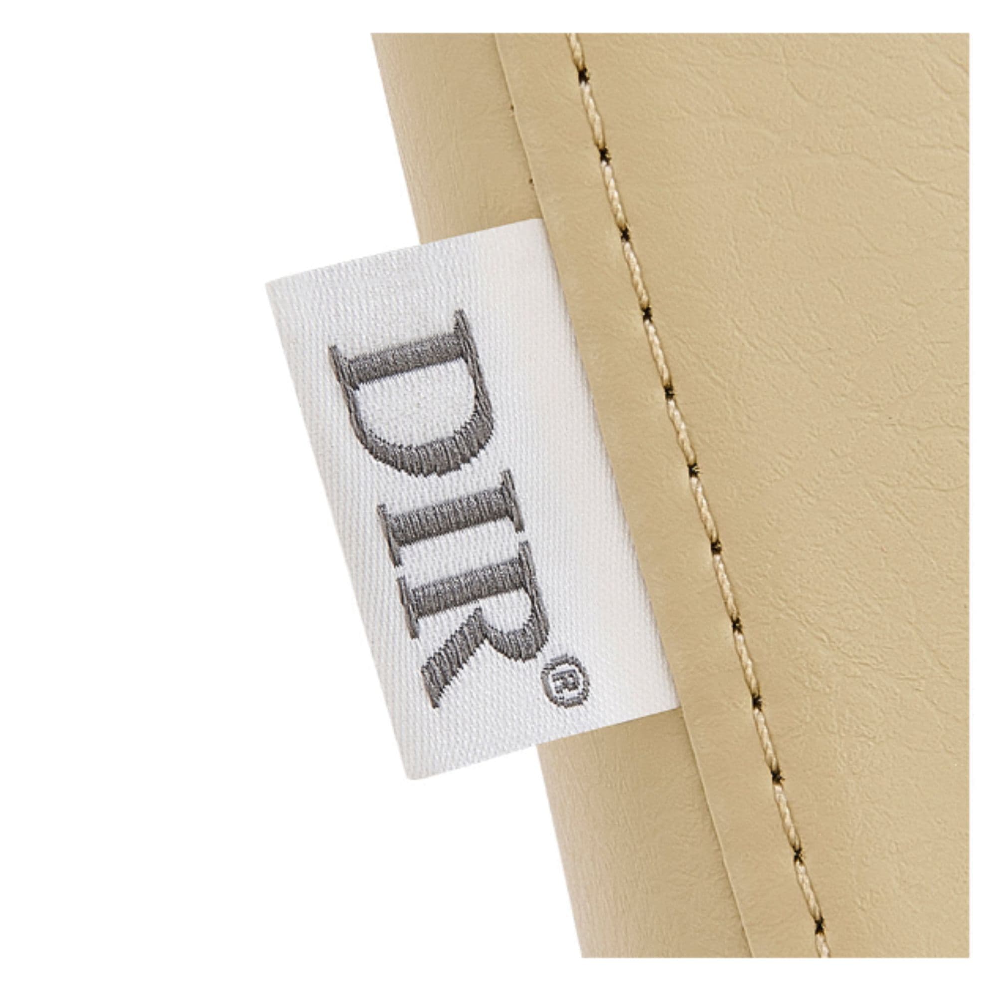 Bella V Recline Massage Shampoo Unit Close-Up View Of Beige Upholstery With Brand Name