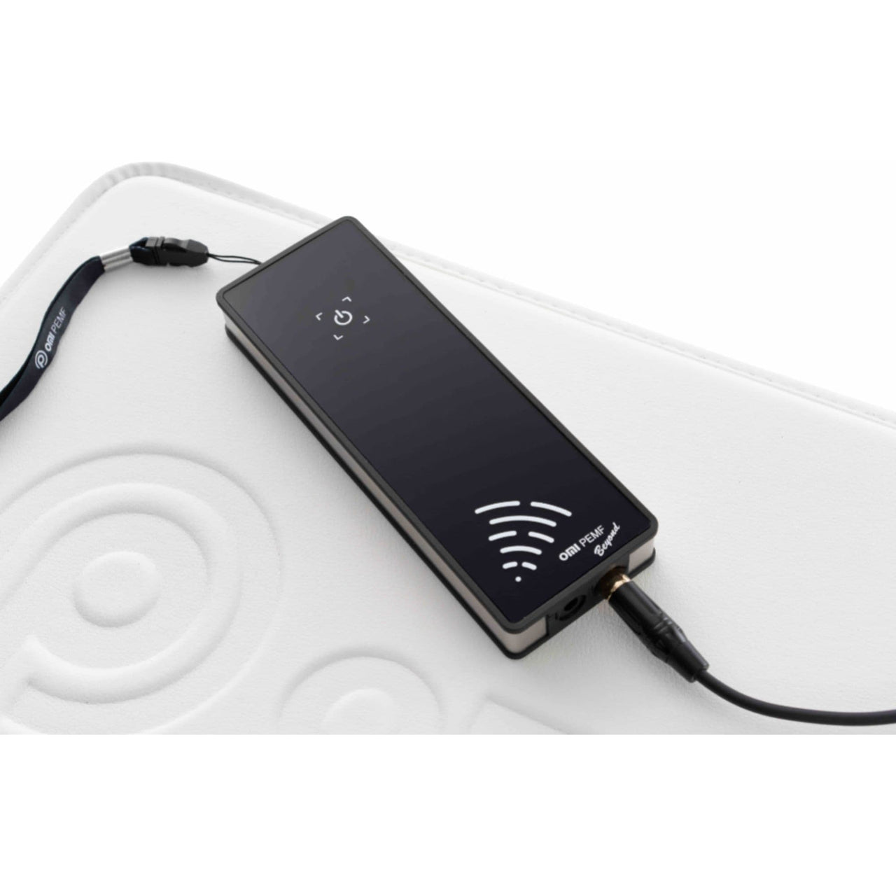 Beyond Power PEMF System by OMI With Modern Wellness Device On White Therapy Mat