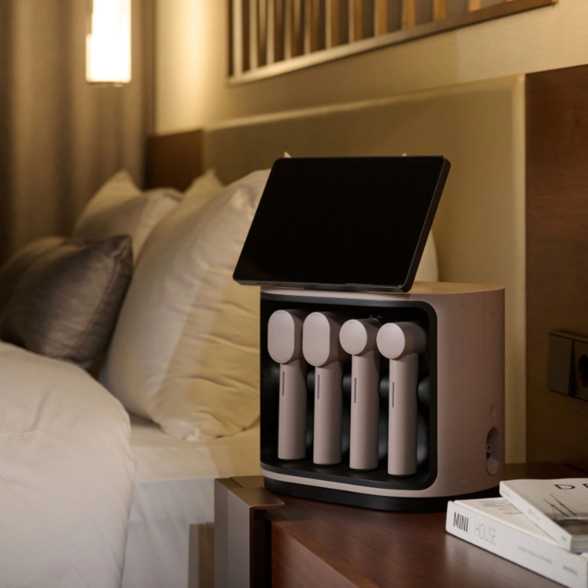 CERAGEM MediSpa Pro At-Home Facial Spa Device Beside The Books In The Modern Bedroom