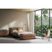 Ceragem S4 Brown Variant At The Foot Of Bed In Spacious Nature-Inspired Bedroom