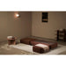 Ceragem S4 Therapeutic Massage Lounger Brown Variant With Side Table And Decoration In Fully Extended Bed Mode