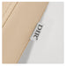 DIR Beckman Adjustable Salon Shampoo Unit Close-Up View Of Beige Upholstery With Brand Name