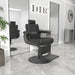 DIR Belgrano Classic Barber Chair Black Variant Front Angled View With Two Tall Mirror A Potted Plant And A Brand Name In The Background