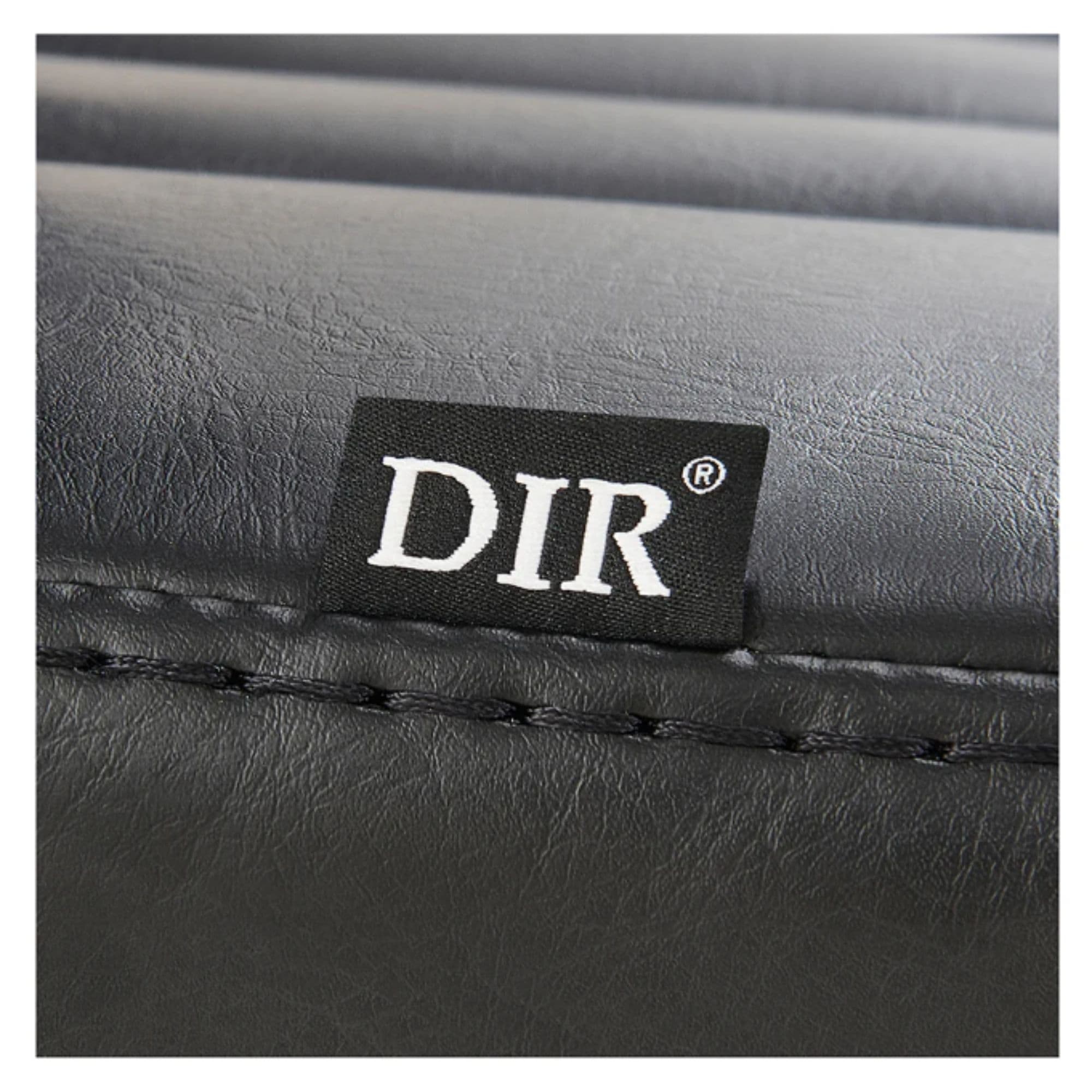 DIR Esquire Reclining Barber Chairs Close-Up View Of Black Upholstery With Horizontal Stitching And Brand Name