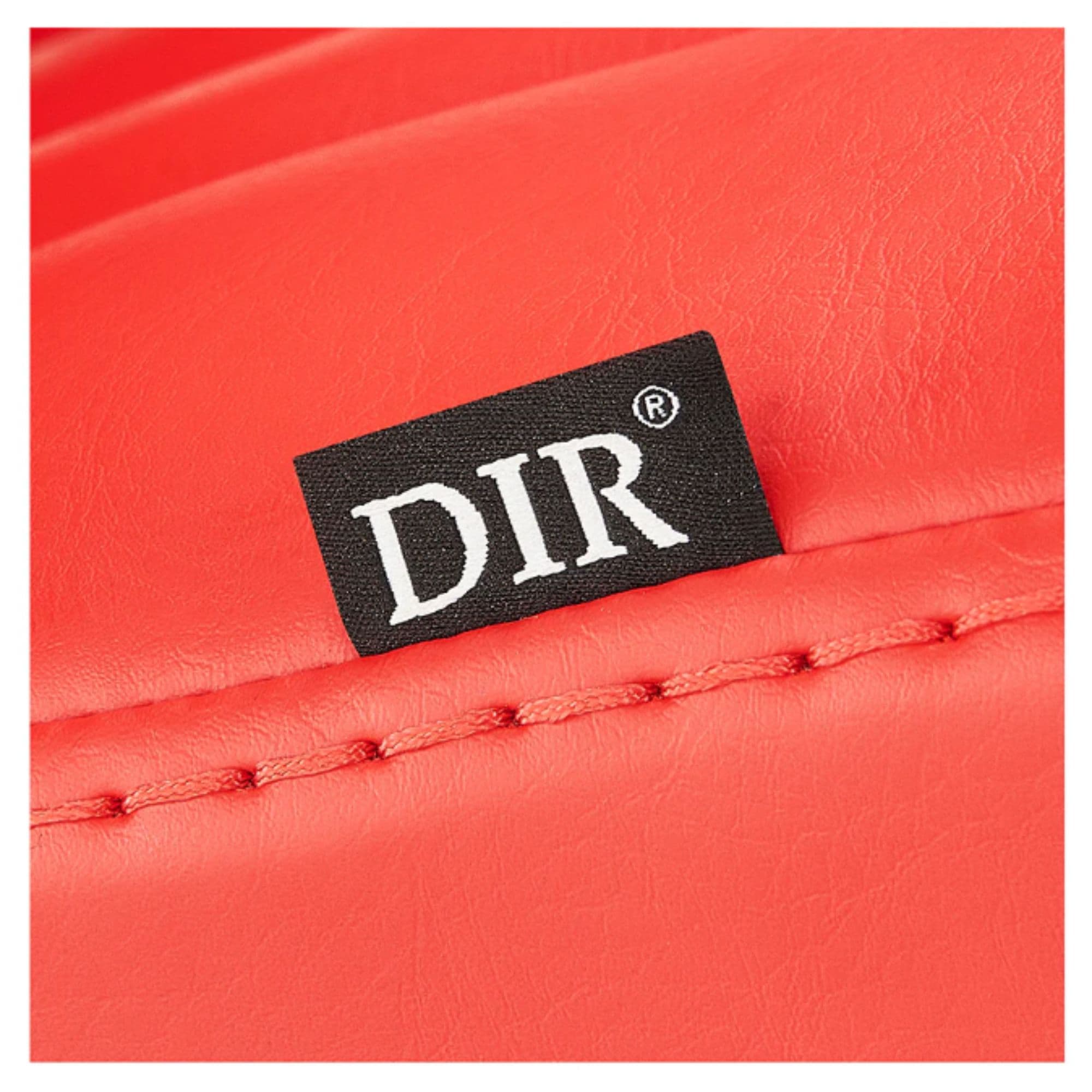DIR Esquire Reclining Barber Chairs Close-Up View Of Red Upholstery With Horizontal Stitching And Brand Name