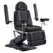 DIR Geneva 4-Motors Exam Table with Stirrups - OB GYN Black Front Angled View Showing Adjustable Armrest Positions On White Background