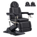 DIR Geneva 4-Motors Exam Table with Stirrups - OB GYN Black Front Angled View With Adjustable Stirrups And Foot Controls On White Background