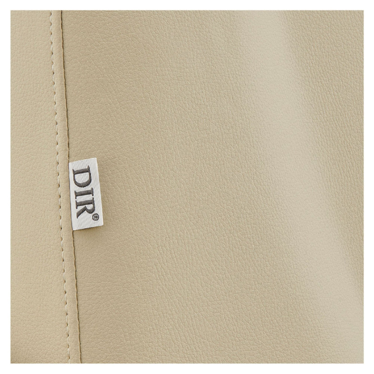 DIR Geneva 4-Motors OB GYN Exam Table with Stirrups Close-Up View Of Beige Upholstery With Brand Name