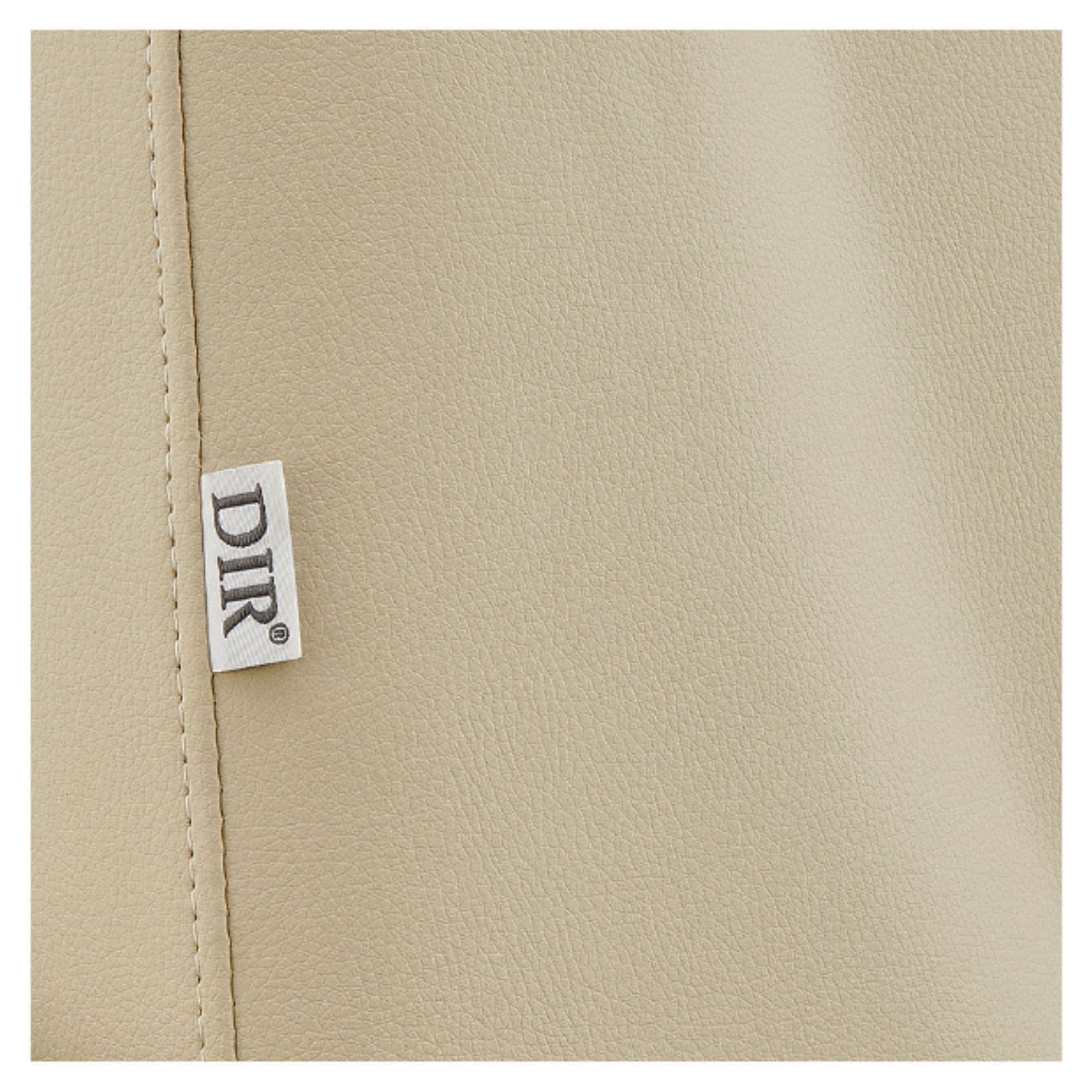 DIR Geneva 4-Motors OB GYN Exam Table with Stirrups Close-Up View Of Beige Upholstery With Brand Name