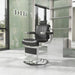 DIR Kingston Hydraulic Barber Chair Black Variant Front Angled View With Glass Doors A Shelves And A Brand Name In The Background