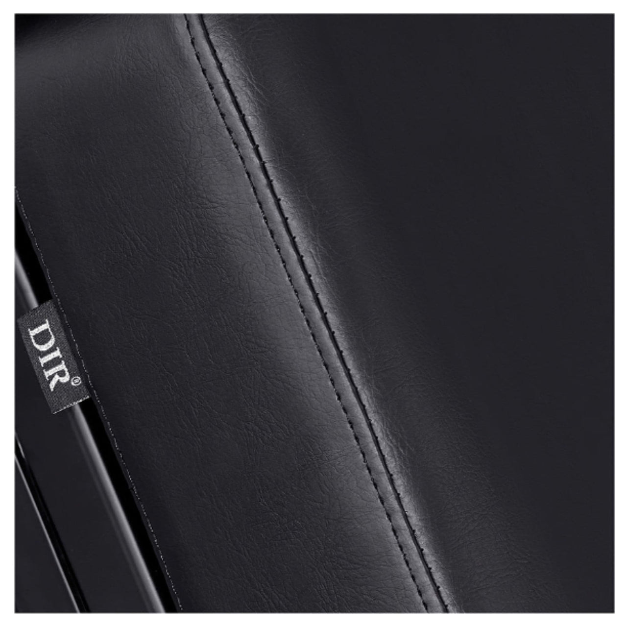 DIR Luxi 4-Motors Medical Spa Treatment Bed Close-Up View Of Black Upholstery With Brand Name And Stitching On White Background
