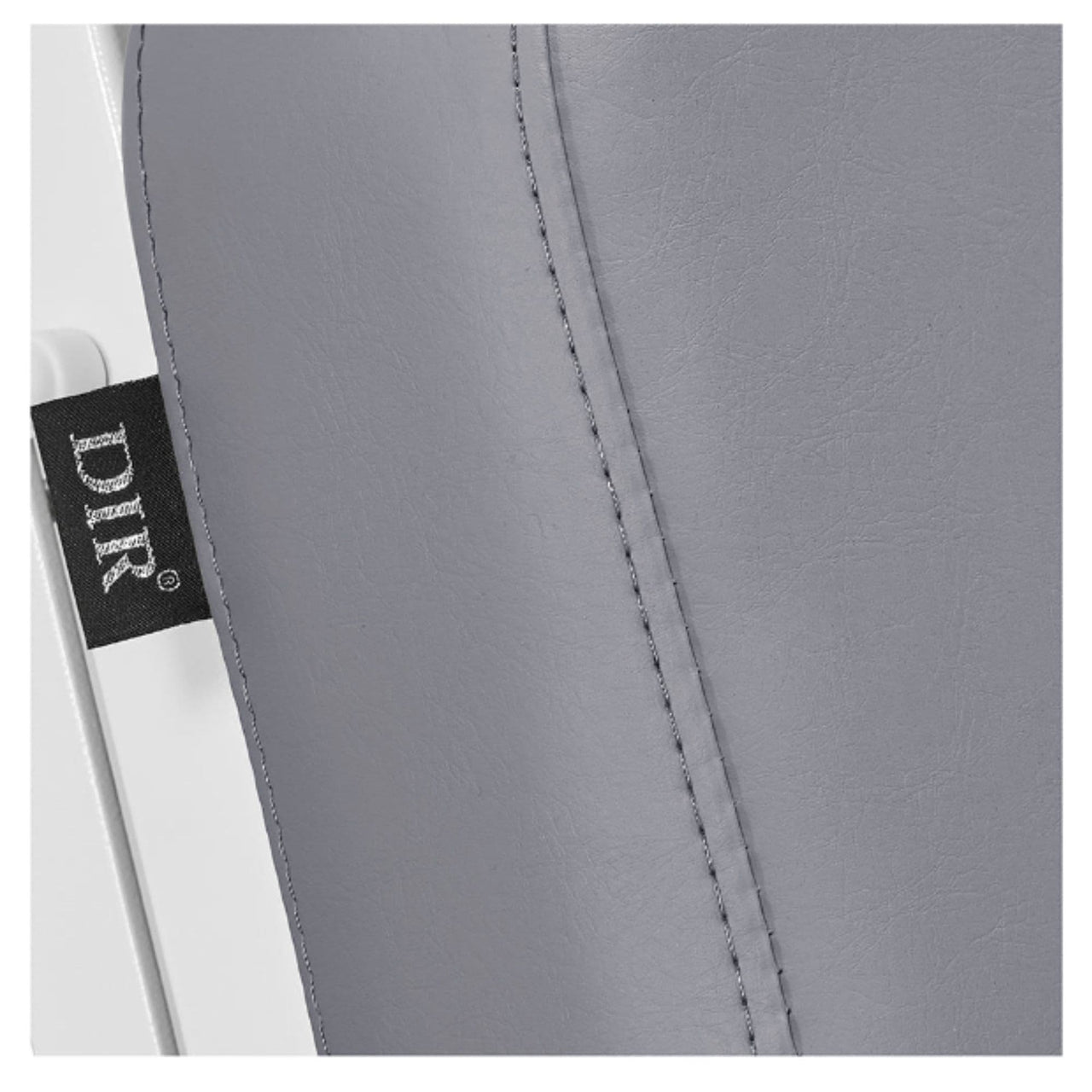 DIR Luxi 4-Motors Medical Spa Treatment Bed Close-Up View Of Gray Upholstery With Brand Name And Stitching On White Background