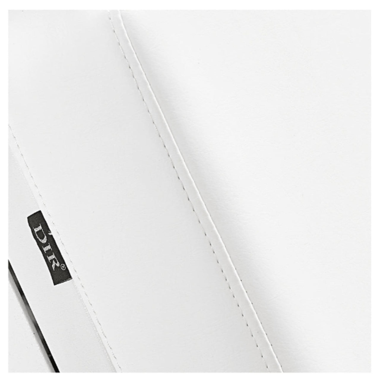 DIR Luxi 4-Motors Medical Spa Treatment Bed Close-Up View Of White Upholstery With Brand Name And Stitching On White Background