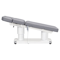 Thumbnail for DIR Luxi 4-Motors Medical Spa Treatment Bed Side View Of Gray Color Fully Reclined Chair And Raised Head Section With Remote Control On White Background