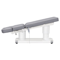 Thumbnail for DIR Luxi 4-Motors Medical Spa Treatment Bed Side View Of Gray Color Fully Reclined Chair With Raised Leg Section And Remote Control On White Background
