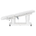 DIR Luxi 4-Motors Medical Spa Treatment Bed Side View Of White Color Fully Reclined Chair With Raised Leg Section And Remote Control On White Background