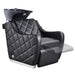 DIR Minervah Massage Backwash Unit Black Front Angled View Of Black Single Shampoo Wash Station With Blurred Leg Rest Demonstration