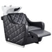 DIR Minervah Massage Backwash Unit Black Front Angled View Of Single Shampoo Wash Station With Fully Reclined Leg Rest On White Clean Background