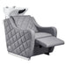 DIR Minervah Massage Backwash Unit Gray Front Angled View Of White Single Shampoo Wash Station With Fully Reclined Leg Rest On White Clean Background