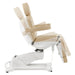 DIR Pavo 4-Motors Swivel Medical Spa Treatment Table Beige Variant Side View Demonstrating Swing Adjustment On White Background