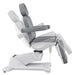 DIR Pavo 4-Motors Swivel Medical Spa Treatment Table Gray Variant Side View Demonstrating Swing Adjustment On White Background