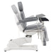 DIR Pavo OB 4-Motors OB GYN Exam Chair with Stirrups Gray Side View Demonstrating Chair And Stirrup Adjustment Positions On White Background