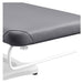 DIR Serenity Electric Treatment Table Close-Up View Of Paper Towel Holder And Gray Upholstery