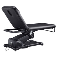 Thumbnail for DIR Serenity Electric Treatment Table Rear View Of Black Color And Reclined On Head Section With Remote Control On White Background