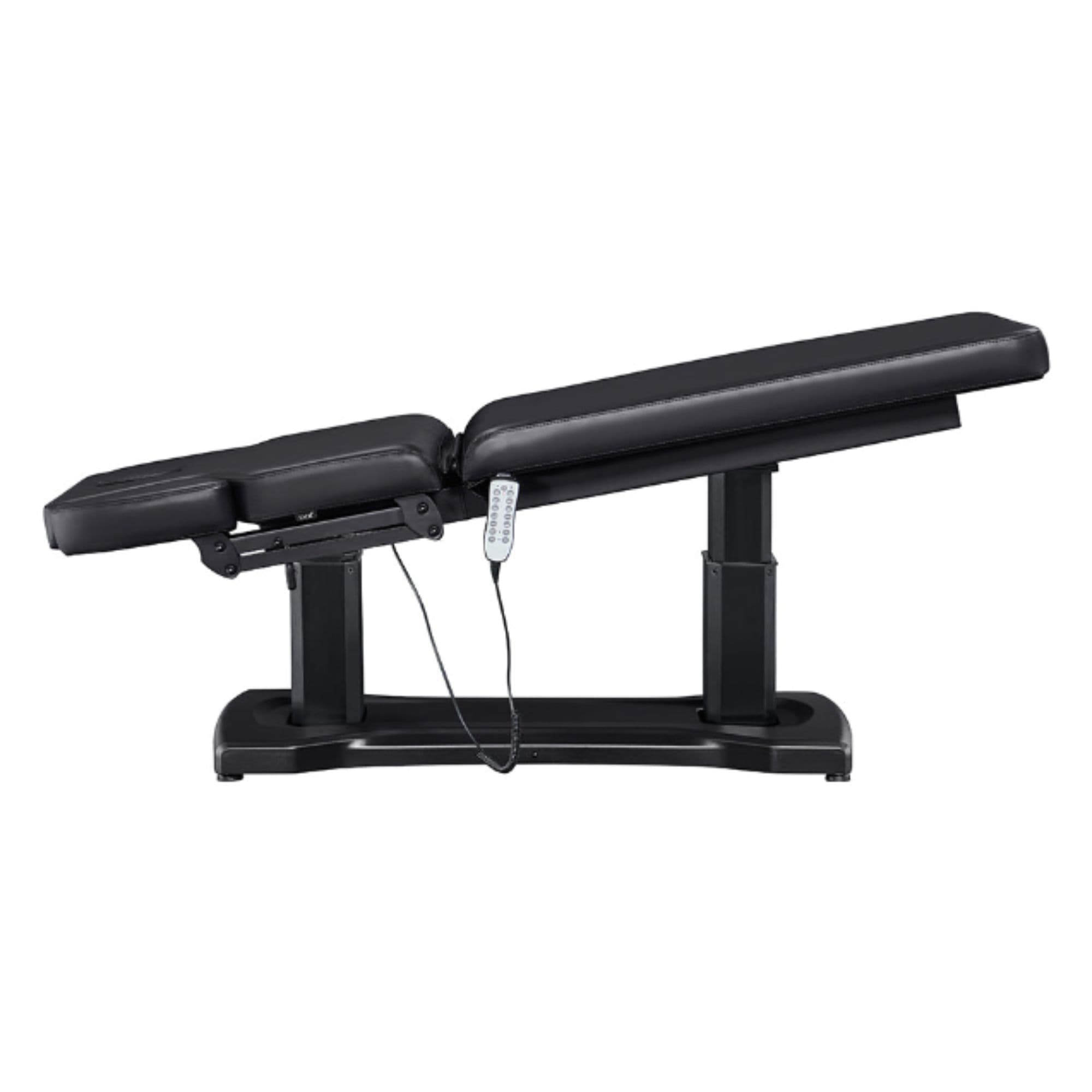 DIR Tranquility 4-Motors Electric Medical Spa Treatment Table Side View Of Black Variant Fully Reclined Chair With Raised Leg Section And Remote Control On White Background