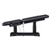 DIR Tranquility 4-Motors Electric Medical Spa Treatment Table Side View Of Black Variant Fully Reclined Chair With Raised Leg Section And Remote Control On White Background