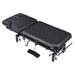 DIR VitalEarth 2-Motors Treatment Table and Wellness Therapy Bed Black Angled Top View With Foot Control On White Background