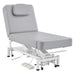 DIR WellRelax 2-Motors Therapy Treatment Table with Tilting Cradle Pillow Gray Front Angled View With Cradle And Foot Control On White Background