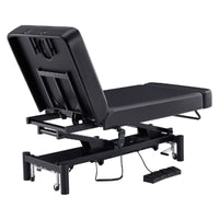 Thumbnail for DIR WellRelax Dual-Motor Treatment Table with Cradle Pillow Black Rear Angled View With Foot Control On White Background