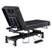 DIR WellRelax Dual-Motor Treatment Table with Cradle Pillow Black Rear Angled View With Foot Control On White Background