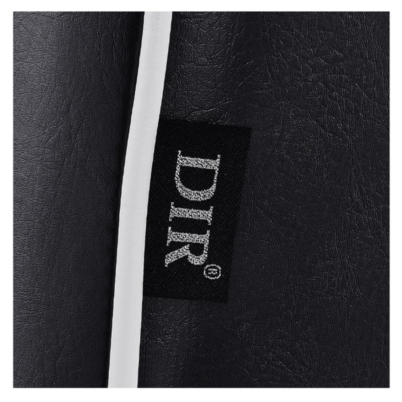 Dainty Reclining Chairs Close-Up View Of Black Upholstery With Brand Name