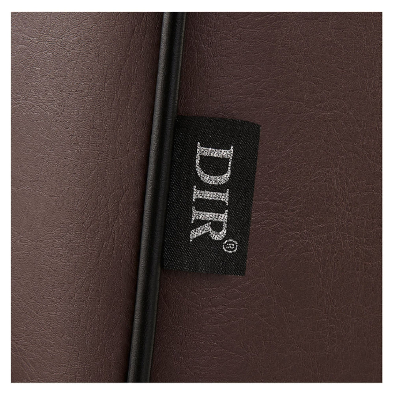 Dainty Reclining Chairs Close-Up View Of Brown Upholstery With Brand Name