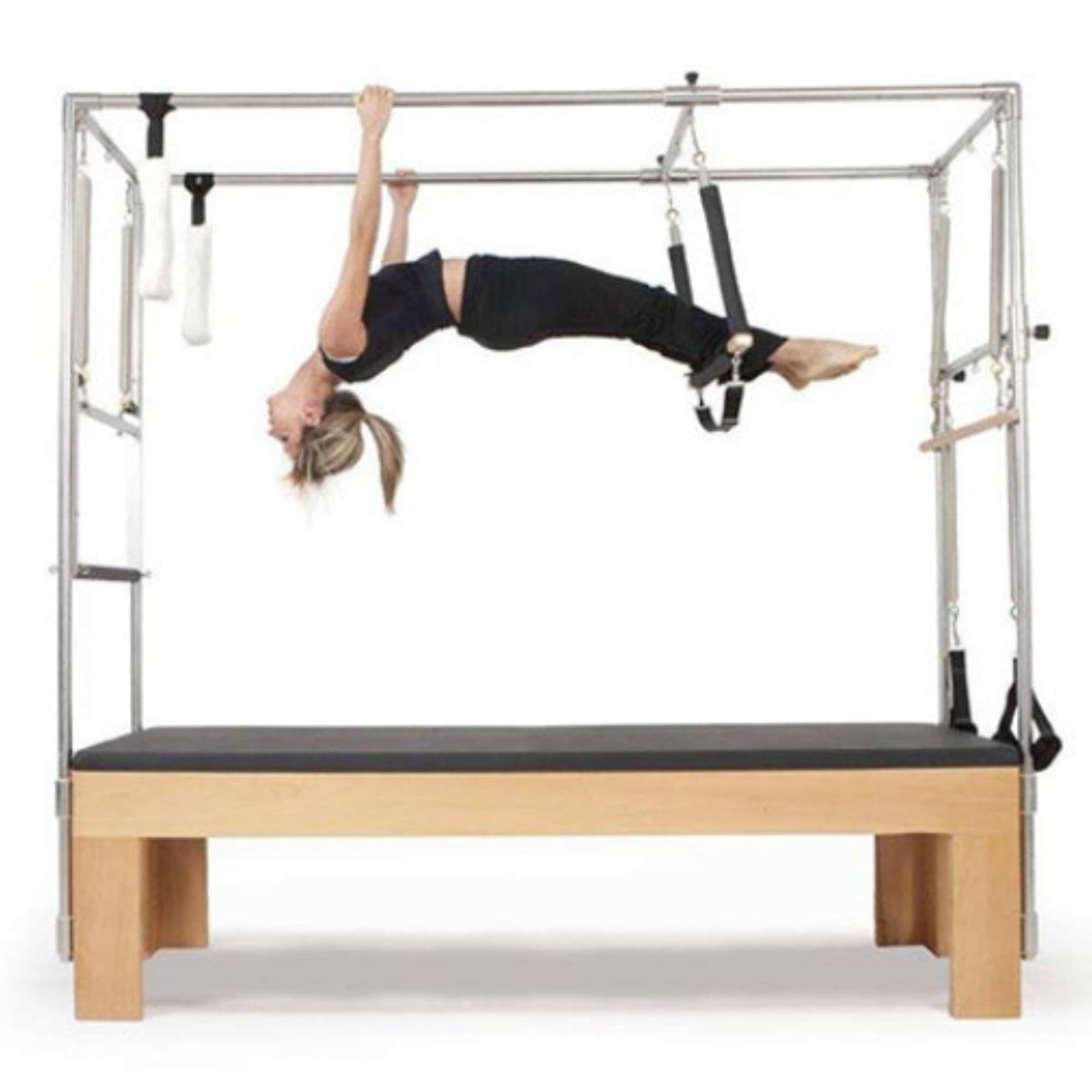 Elina Cadillac Side View Of A Woman Demonstrating A Pilates Exercise Using Leg Straps