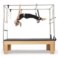 Thumbnail for Elina Cadillac Side View Of A Woman Demonstrating A Pilates Exercise Using Leg Straps