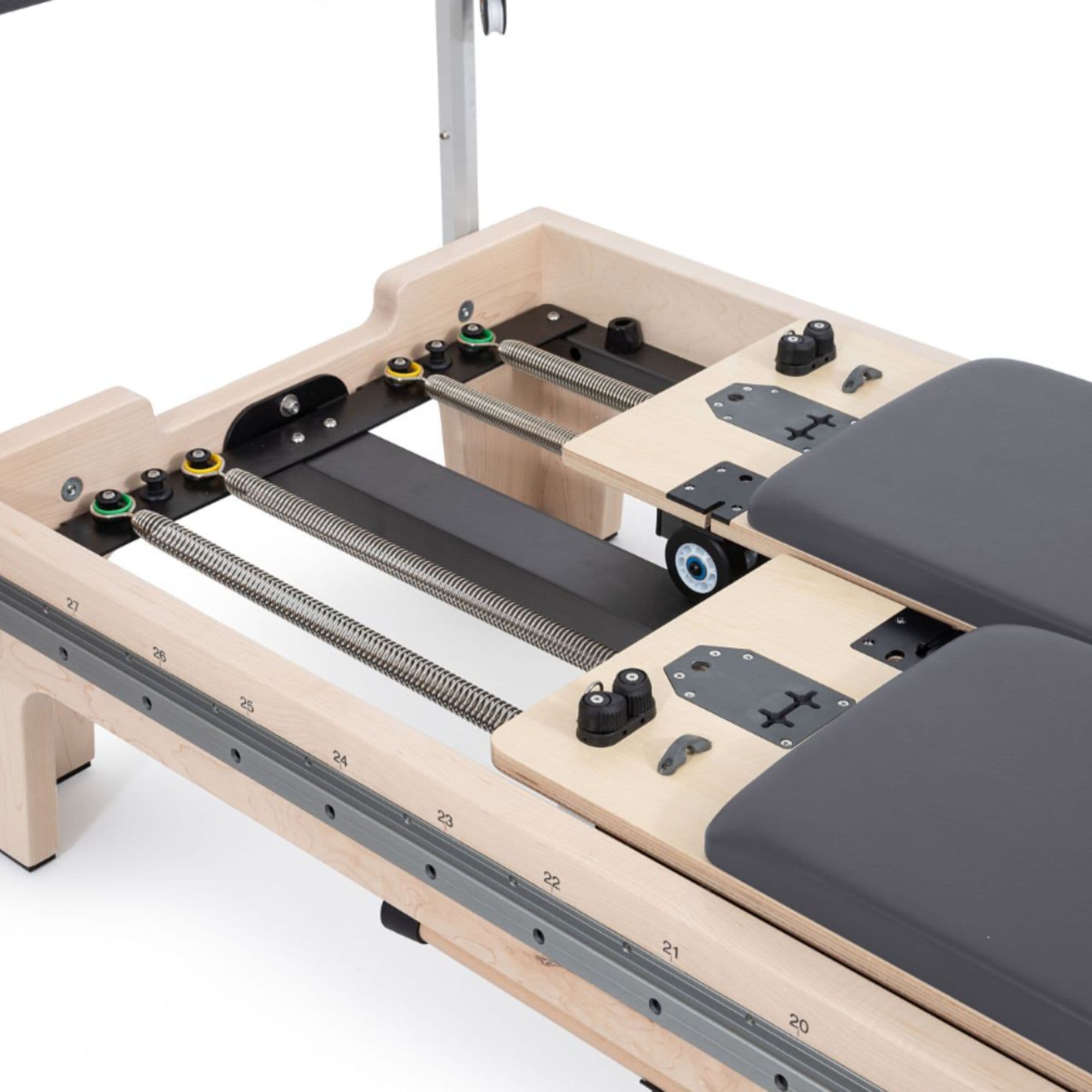 Elina Dual Pilates Reformer Top Angled View With Split Carriage And Spring System On White Background