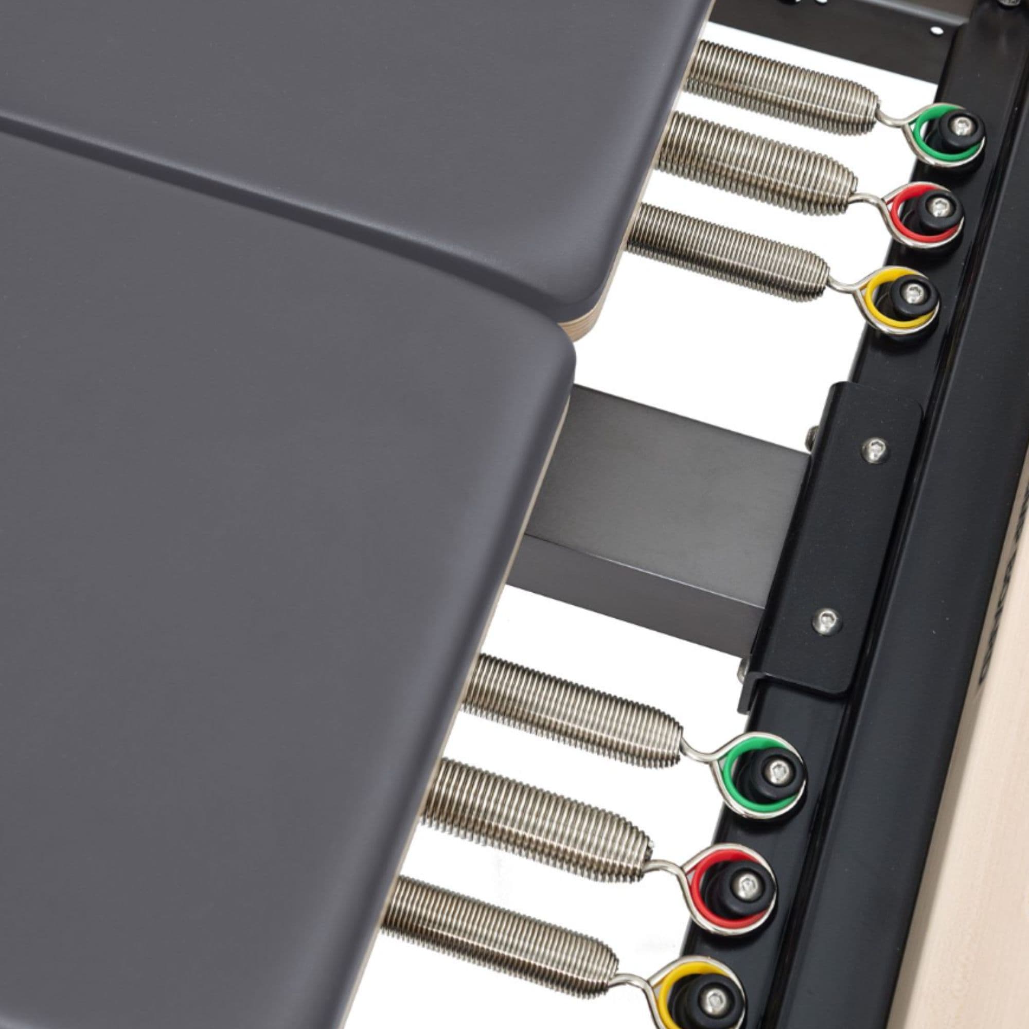 Elina Dual Station Twin Reformer Top View With Color-coded Spring On White Background