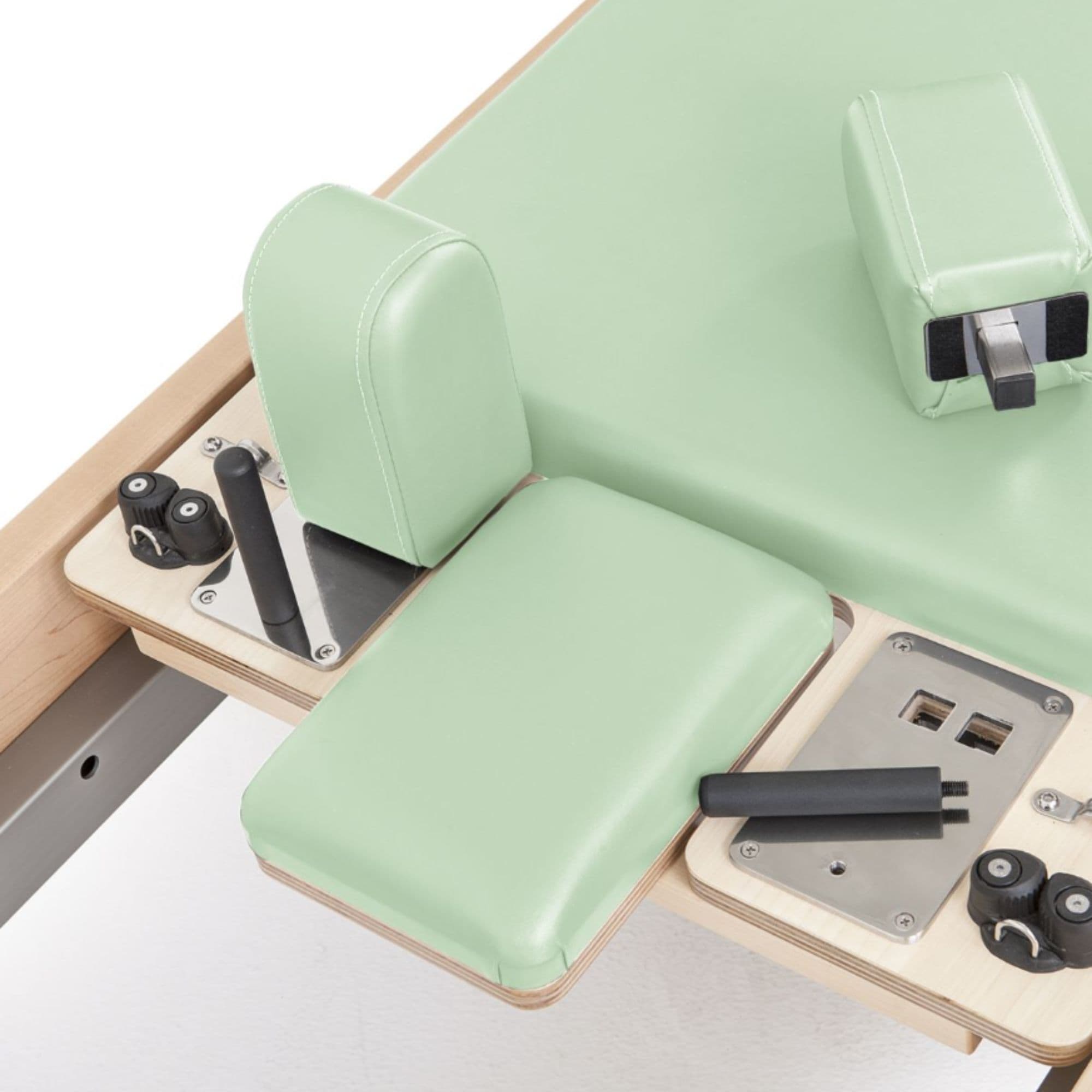 Elina Elite Wood Reformer Green Variant Close-Up View Of Shoulder Blocks And Sitting Box Attachment Components