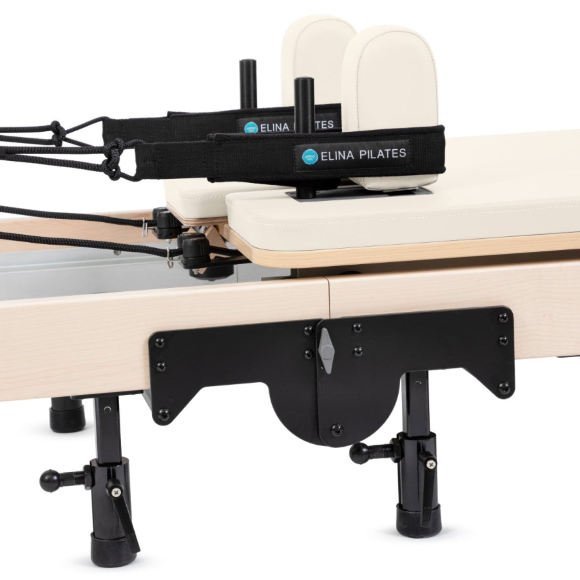 Elina Foldable Reformer for Home Ivory Variant Close-Up View Of The Carriage And Adjustable Shoulder Rests