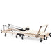 Elina Foldable Reformer for Home Ivory Variant Side View With Rope And Spring Resistance System