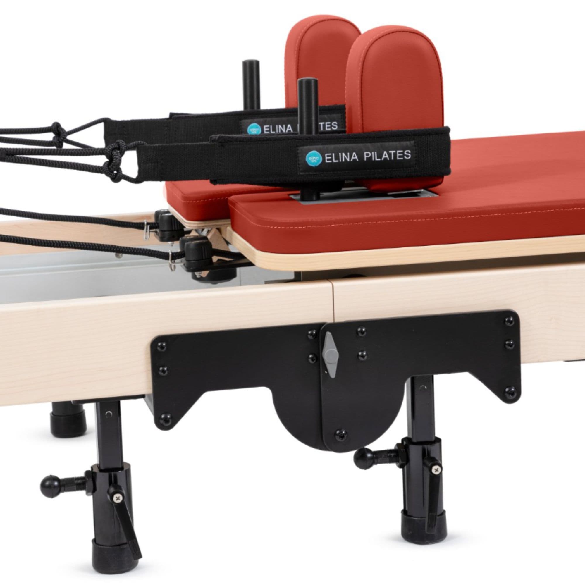 Elina Foldable Reformer for Home Red Variant Close-Up View Of The Carriage And Adjustable Shoulder Rests