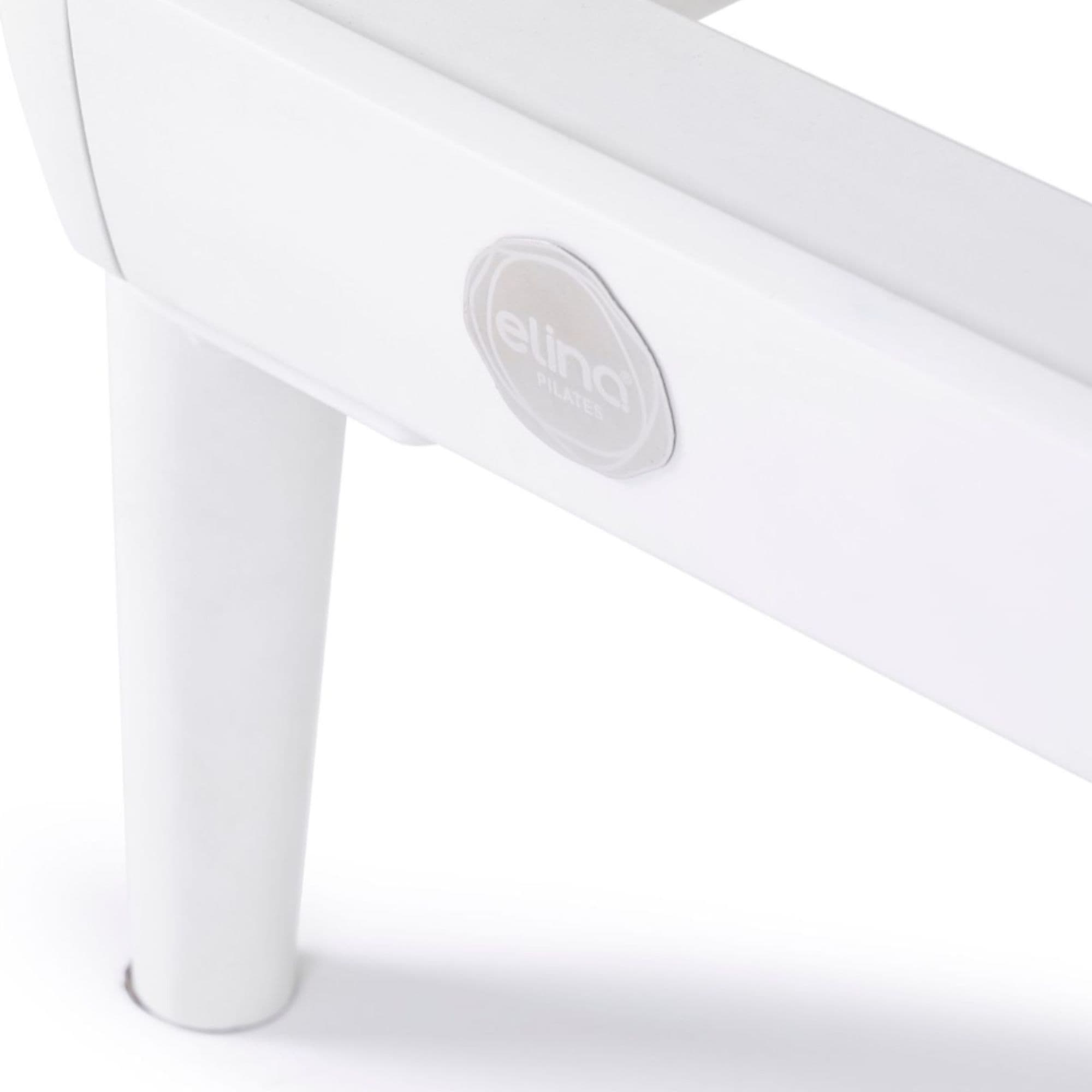 Elina Nubium Reformer with Tower Close-Up View Of Logo Badge And Support Leg On White Background