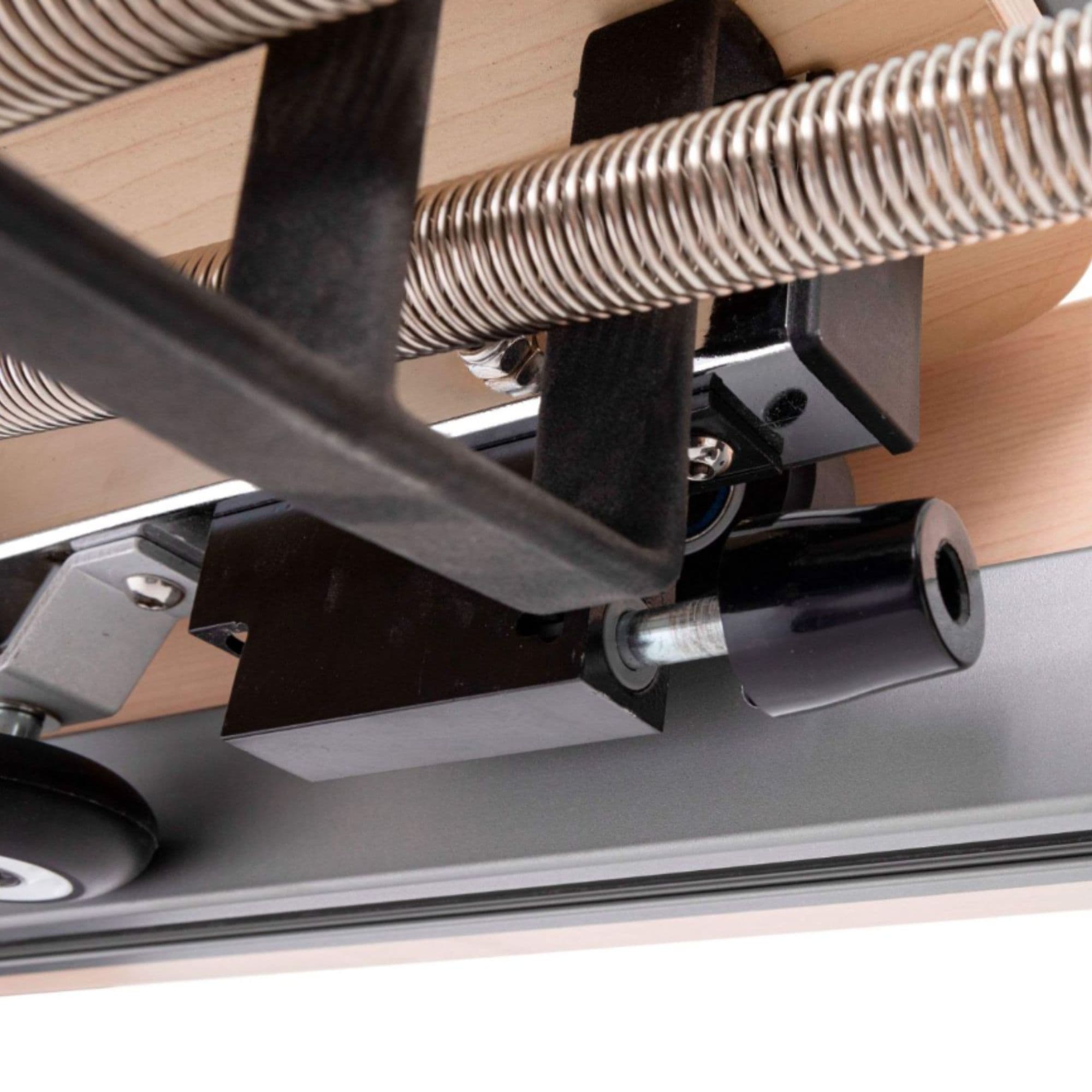 Elina Physio Reformer Master Instructor Close-Up View Of Under-Carriage Stopper And Carriage Bumper System