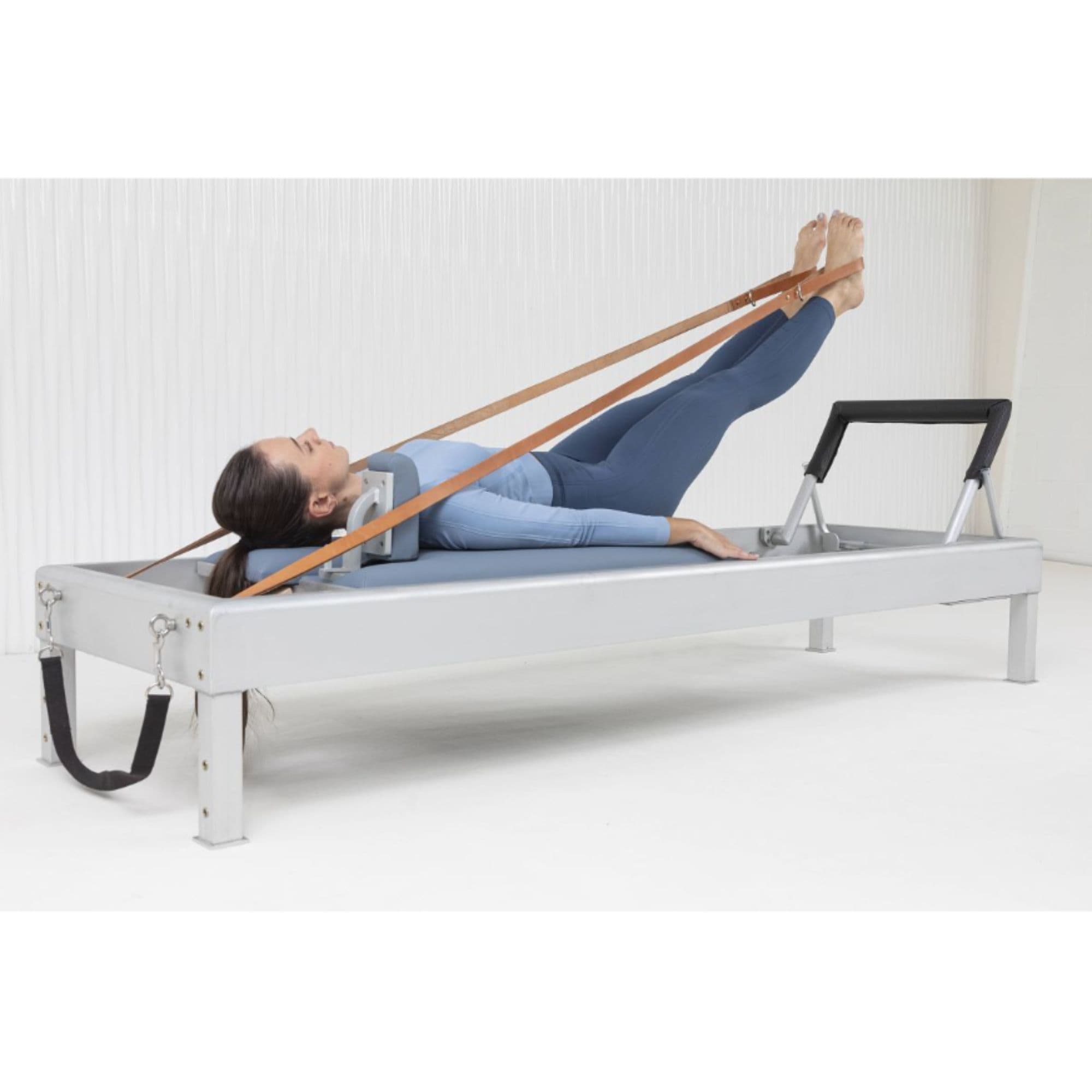 Elina Pilates Classic Aluminium Reformer 86 Inches  With A Woman Performing A Pilates Reformer Exercise With Leather Foot Straps